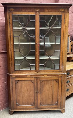 Lot 2125 - A Georgian inlaid oak freestanding corner...