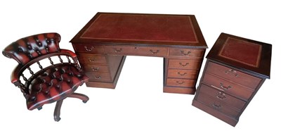 Lot 2075 - A reproduction mahogany nine drawer pedestal...