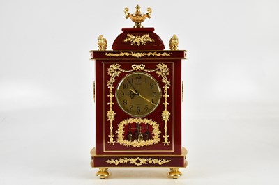 Lot 2377 - SEIKO; an ornate red lacquer effect and gilt...