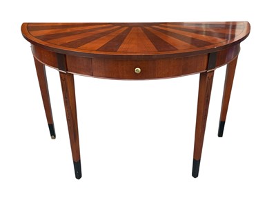 Lot 2096 - A reproduction demi-lune single drawer console...
