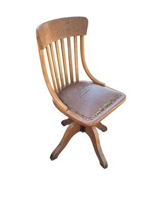 Lot 2186 - An early 20th century oak and beech swivel...