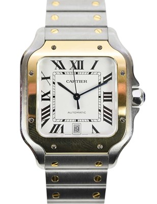 Lot 550 - CARTIER; a stainless steel and yellow gold...