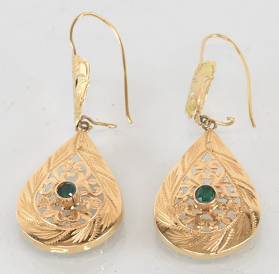 Lot 1486 - A pair of Moroccan yellow metal emerald set...