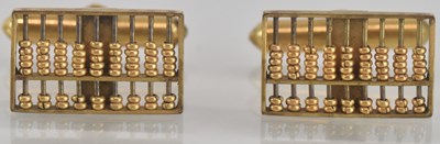 Lot 1272 - A pair of gold coloured metal cufflinks in the...