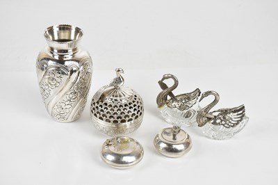Lot 1499 - An Eastern white metal vase with embossed...