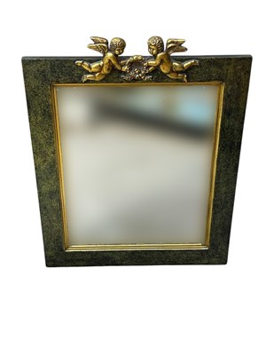 Lot 2290 - A modern wall mirror decorated with cherubs,...