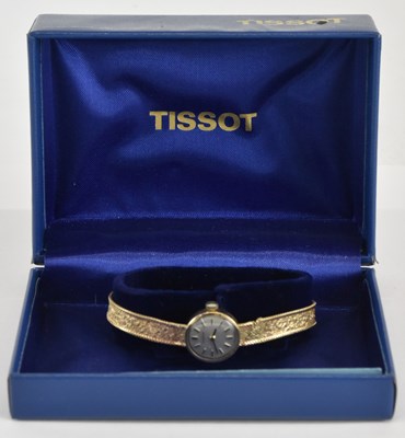 Lot 1777 - TISSOT; a lady's 9ct gold wristwatch, the...