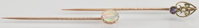 Lot 1553 - A yellow metal opal set stick pin, length...