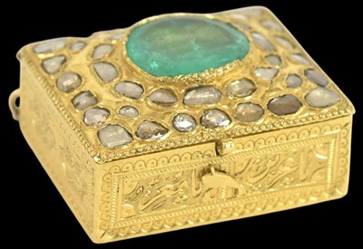 Lot 1194 - A Middle Eastern yellow metal emerald and...