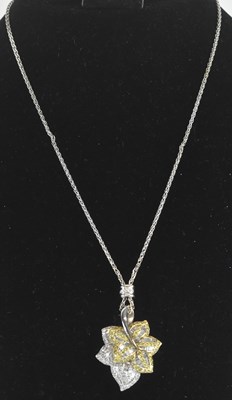 Lot 1376 - A white metal diamond and yellow diamond leaf...
