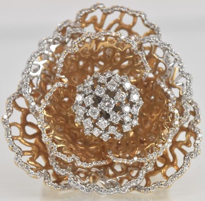 Lot 1216 - An 18ct yellow gold diamond set cocktail ring...