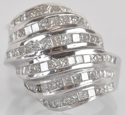 Lot 1214 - An 18ct white gold diamond set cocktail ring...