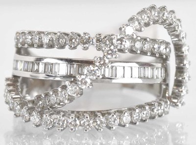 Lot 1144 - An 18ct white gold diamond set ring of...
