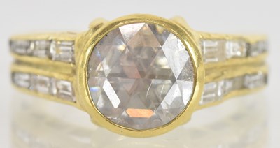 Lot 1212 - An unusual yellow metal diamond set signet...