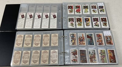 Lot 338 - Two albums of twenty sets of cigarette cards,...