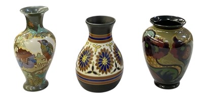 Lot 665 - GOUDA POTTERY; three Dutch art pottery vases,...