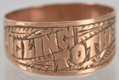Lot 1369 - A 9ct rose gold ring, with the religious words...