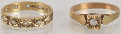 Lot 1300 - Two 9ct gold dress rings, one with a single...