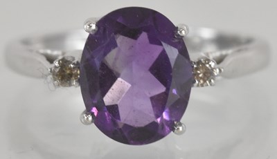 Lot 1313 - A white gold dress ring with claw set cut...