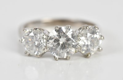 Lot 30 - A white metal diamond set three stone dress...