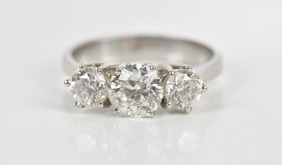 Lot 37 - A white metal diamond three stone dress ring,...