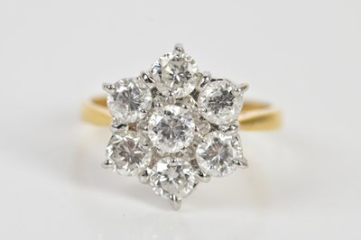 Lot 38 - An 18ct yellow gold diamond seven stone daisy...