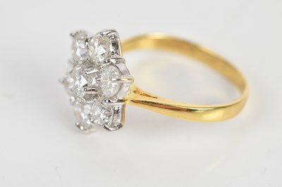 Lot 38 - An 18ct yellow gold diamond seven stone daisy...