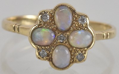 Lot 1314 - A 9ct gold opal and diamond set ring, the...