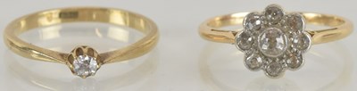 Lot 1311 - An 18ct gold ring with diamond floral cluster...