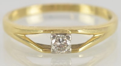 Lot 1237 - An 18ct gold diamond solitaire ring, the claw...
