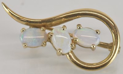 Lot 1555 - A 9K gold brooch in the form of three claw set...