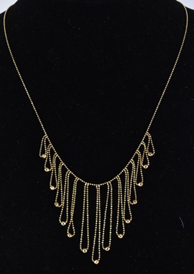 Lot 1423 - A 14ct gold fringe necklace of dainty form...