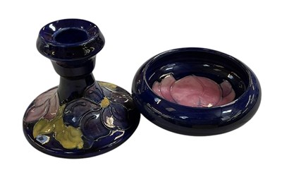 Lot 669 - MOORCROFT; a small short candlestick, height...