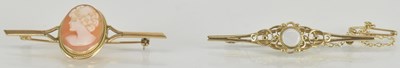 Lot 1554 - Two 9ct gold bar brooches, one set with oval...