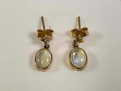 Lot 593 - A pair of 9ct yellow gold moonstone drop...