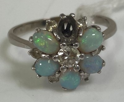 Lot 369 - An 18ct white gold opal and diamond flower...
