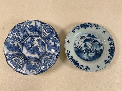 Lot 233 - An 18th century Delft plate, decorated with a...