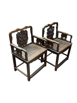 Lot 109 - A pair of Chinese hard wood chairs with carved...