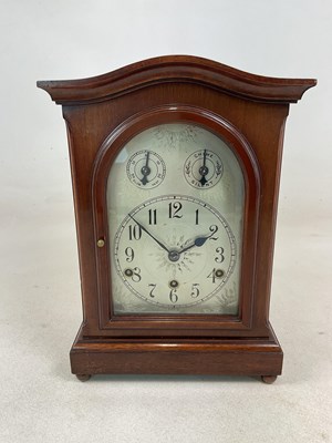 Lot 646 - A mahogany mantel clock, with Windsor chimes...