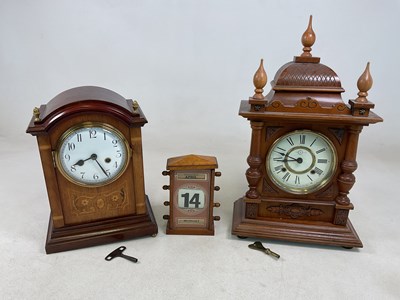 Lot 645 - Two mantel clocks, an inlaid mahogany example...