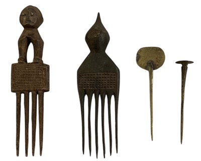 Lot 770 - Two Lobi people, Burkina Faso head scratchers...