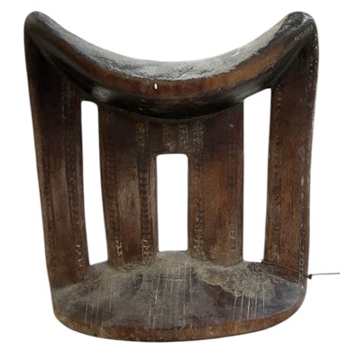 Lot 778 - An Ethiopian carved wooden headrest, with...