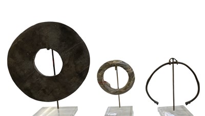 Lot 771 - A group of three Manilla trading tokens, once...