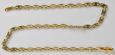 Lot 1379 - An 18ct yellow and white gold long link...