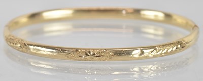 Lot 1602 - A 14ct yellow gold snap bangle, diameter...