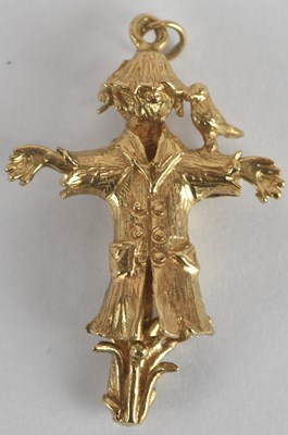 Lot 1445 - A 9ct yellow gold articulated charm, modelled...