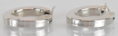 Lot 1503 - A pair of 14ct white gold hoop earrings,...