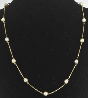 Lot 1391 - An 18ct yellow gold seed pearl set fine link...
