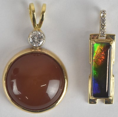 Lot 1465 - An 18ct white gold ammolite and white zircon...