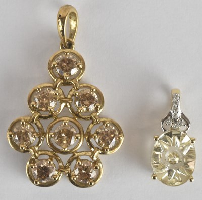 Lot 1447 - A 9ct yellow gold diamond set pendant, set...